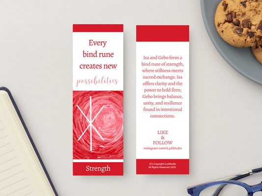 Two red and white rune-themed bookmarks displayed on a light gray surface, with an open notebook, cookies on a plate, and eyeglasses partially visible around them.